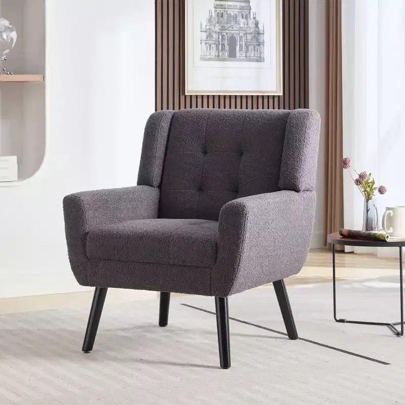 Fauteuil moderne avec revêtement capitonné et pieds en bois