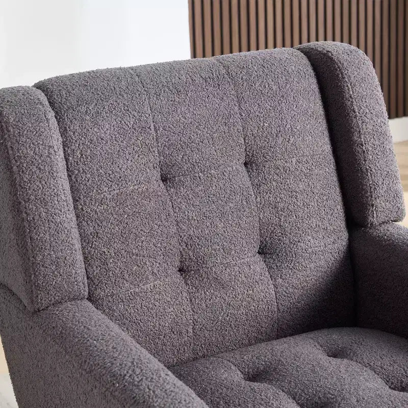 Fauteuil moderne avec revêtement capitonné et pieds en bois