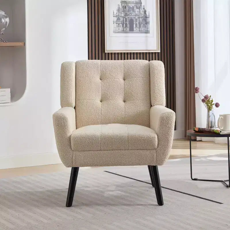 Fauteuil moderne avec revêtement capitonné et pieds en bois