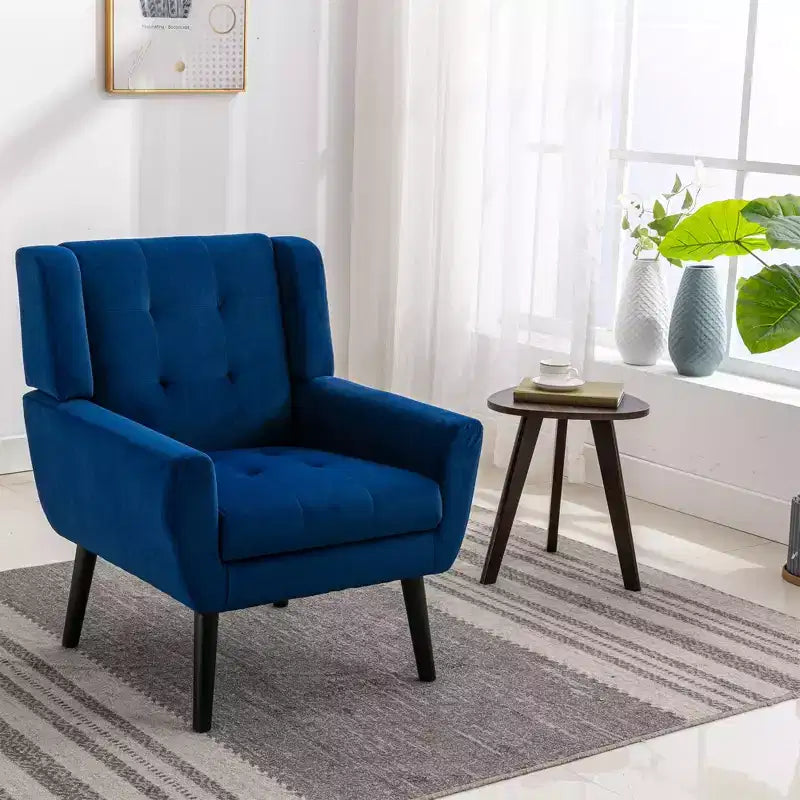 Fauteuil moderne avec revêtement capitonné et pieds en bois