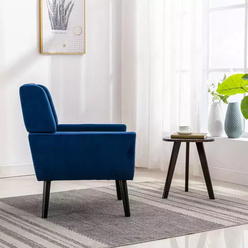 Fauteuil moderne avec revêtement capitonné et pieds en bois