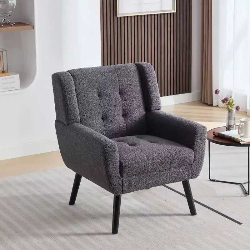 Fauteuil moderne avec revêtement capitonné et pieds en bois