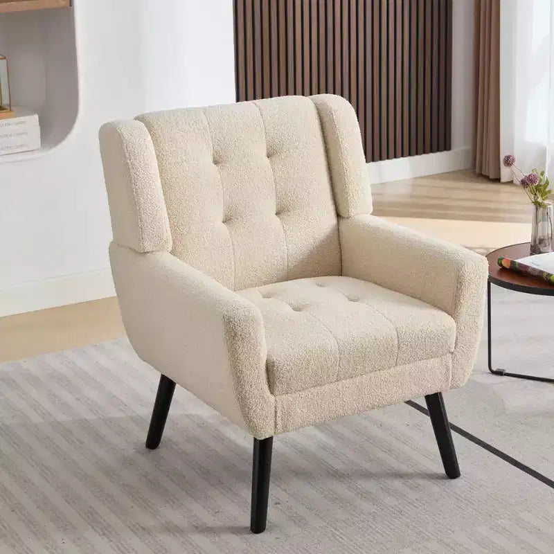 Fauteuil moderne avec revêtement capitonné et pieds en bois